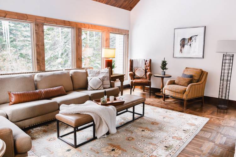 A room with a couch flooded with natural light 