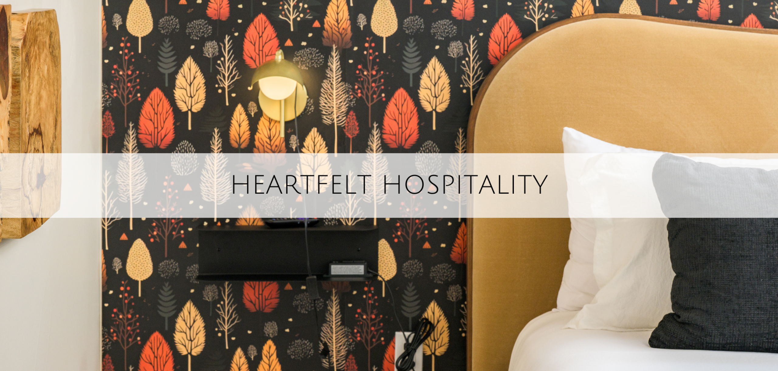 A bedroom with a fall patterned wallpaper located in Summit County Colorado